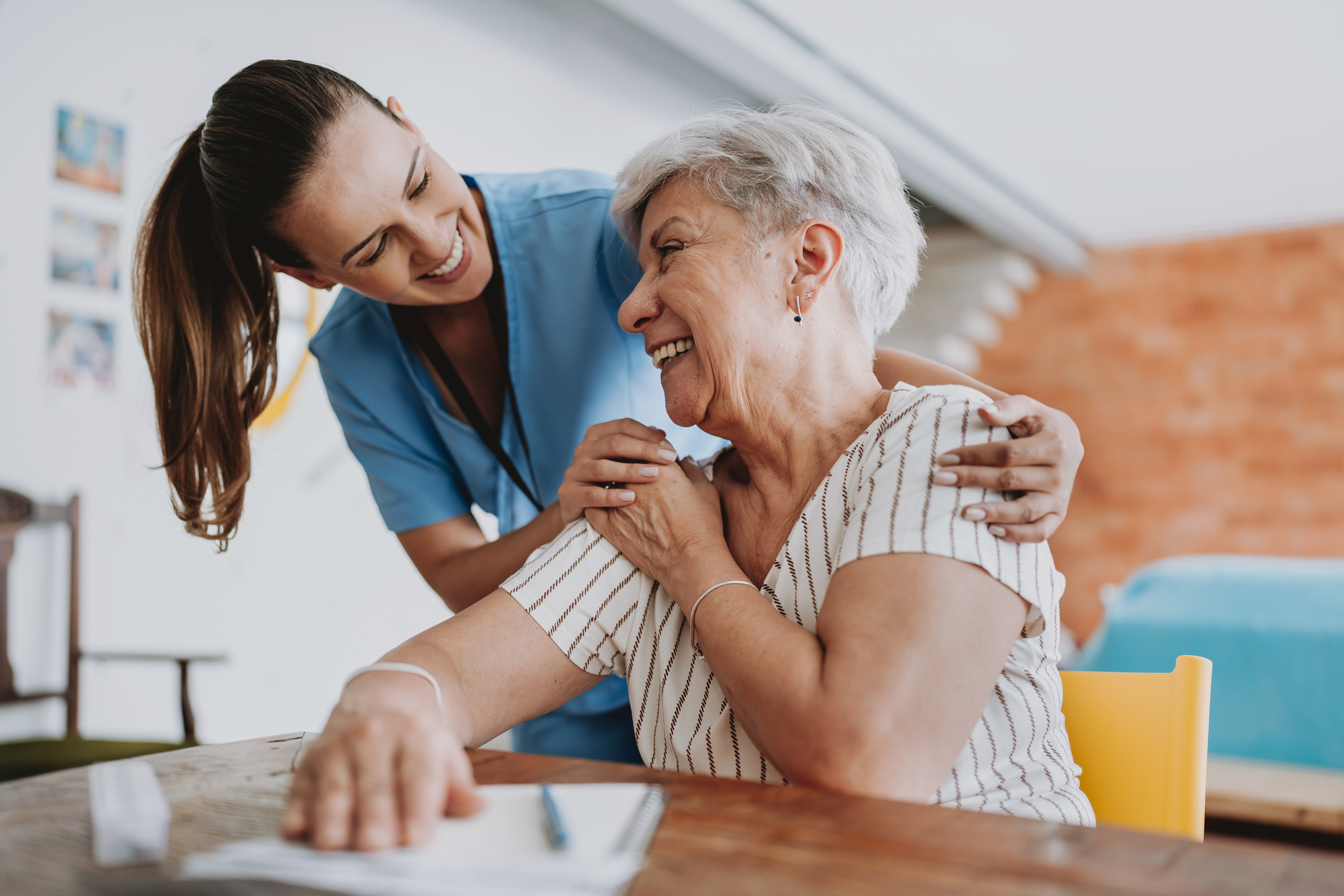 Nurse and patient laughing